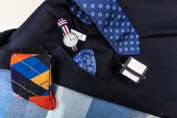 Men accessory, Arm button, navy blue cowl, tie, wrist watch, handkerchief, bracelet, socks.