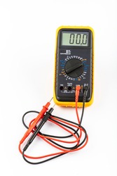 Multimeter for a measurement of a voltage, current and resistance with cables. Digital multimeter to check the resistance on a white background.