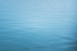 blue sea with waves and calm ocean water surface with small ripples