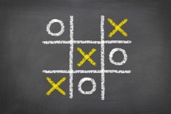 A game of tic tac toe played on a chalk board shows the need to be a critical thinker in the world of gaming.
