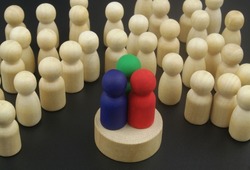 Show, political debates and election concept. Three different candidates or speakers - colored figures and many wooden figures as people listening them.