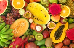 Tropical fruits background, many colorful ripe tropical fruits 