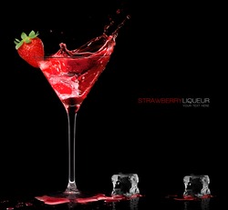 Stylish cocktail glass with red liquor splashing out, garnished with a ripe fresh strawberry, closeup isolated on black with sample text. Party concept. Template design.