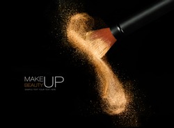 Soft cosmetics brush releasing a cloud of glowing sparkling face powder over a black background with copy space in a beauty and makeup concept