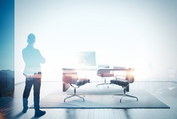 Double exposure photo of businessman in contemporary office. Color