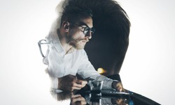 Portrait of stylish bearded lawyer wearing glasses and looking city. Double exposure, businessman working laptop at night, texting smartphone background. Isolated white. Horizontal