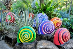Colorful of sculpture snails in beautiful garden.