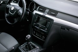 luxury car Interior - steering wheel, shift lever and dashboard. 