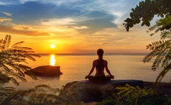 serenity and yoga practicing at sunset,meditation