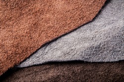 Piece of Leathers and Suede, Earth Tone. Concept and Idea of Fine Leather Crafting, Handmade, Handcrafted Artisan, Leather and Fashion Industry. Background Textured and Wallpaper.
