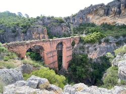 Ancient roman empire aqueduct Peña Cortada in Calles, Valencia, Spain