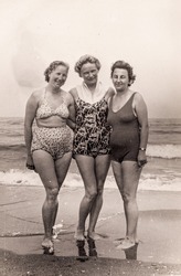 Vintage photo of three women on beach (1950's)