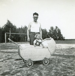 Vintage photo of young father with baby daughter (fifties)
