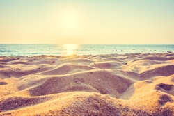 Beautiful beach sand and sea at sunset times with copy space for background - Vintage Filter and Boost up color Processing