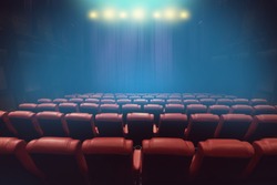 empty theater auditorium or movie cinema with red seats before show time