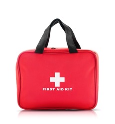 Red bag with first aid kit isolated on white background
