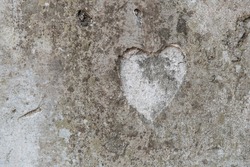 The shape of a heart on a old concrete wall 