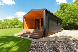 exterior of a suburban compact modular cabin for family vacations