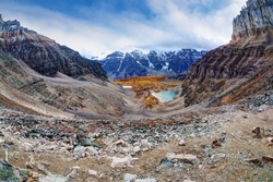 Panorama of Sentinel Pass in the Canadian Rockies at Moraine Lake with Mount Temple and Eiffel Peak, nicknamed Eiffel Tower, opening up to Larch Valley with the famous snow-capped Valley of Ten Peaks.