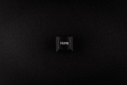 black Home button from keyboard on black background with copy space,  in concept of business and banking.