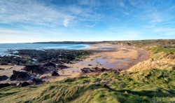 Blue skies over the beach at Freshwater West at Castlemartin in the Pembrokeshire Coast National Park in Wales