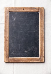 Vintage slate chalk board on textured background