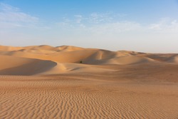 Wide and wild landscape of the Arabic sand desert in the dead quarter