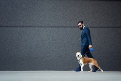 Businessman walking with his dog.