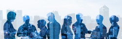 Double exposure of group of businessperson and cityscape.
