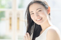 Beauty concept of attractive asian woman. Skin care. Hair care.