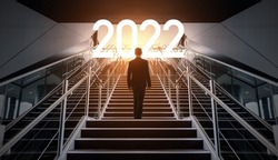 New year concept of 2022. New year's card. Businessman on the staircase.