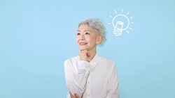 Asian senior woman with ideas. Inspiration. Imagination.