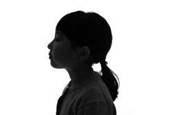 Silhouette of little girl profile.