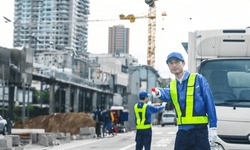 Security guard controlling traffic at a construction site.