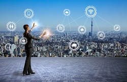 modern cityscape and business person, Internet of Things, Information Communication Technology, abstract image visual