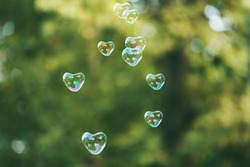Soap bubbles in heart shape outdoor