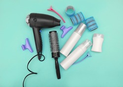 Hairdresser set with various accessories on turquoise background