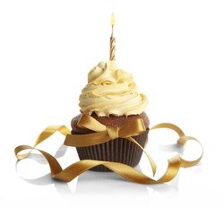 Birthday cupcake and ribbon on white background