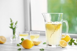 Cold fresh lemonade on windowsill