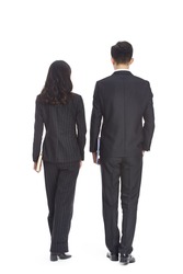 young asian business man and woman walking, rear view, isolated on white background.
