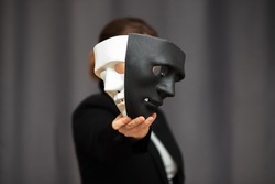 mask drama and comedy in theatre holds the actor before going out to the stage for play performance, chooses between a black and white hero