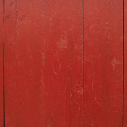 Painted red wooden fence fragment as a background texture
