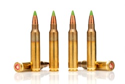 A group of 5.56 calibar, green tip bullets on white background