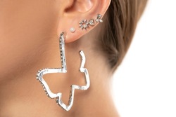 Ear piercings and five ear rings photos.Helix piercing.Ear rings. Close up.