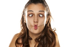 Young funny woman making fish face
