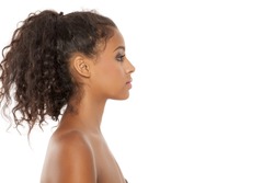 Profile of a beautiful young dark-skinned woman on a white background
