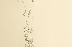 Beautiful champagne bubbles over a blurred background