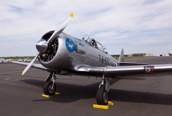 AT-6 Texan, known as the Harvard training plane on runway