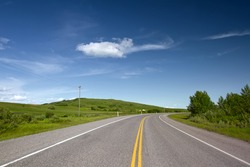 Road With Painted Double Yellow Line. Photo is taken in Alberta, Canada.