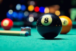 Billiard Balls / A Vintage style photo from a billiard balls in a pool table. Noise added for a film effect